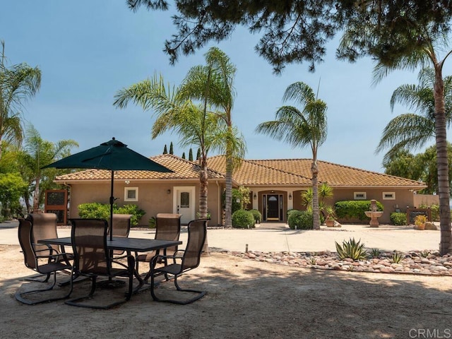 31755 Rancho Vista Rd, Temecula, CA 92592 - back of property featuring stucco siding, a tile roof, outdoor dining space, and a patio