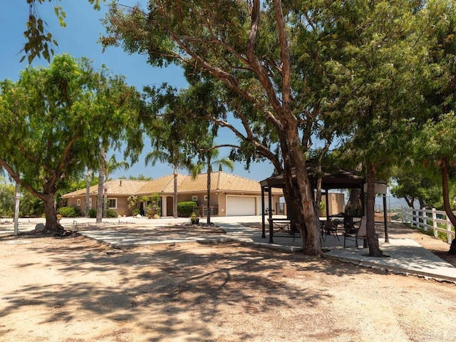 31755 Rancho Vista Rd, Temecula, CA 92592 - ranch-style home with a gazebo, a garage, and stucco siding