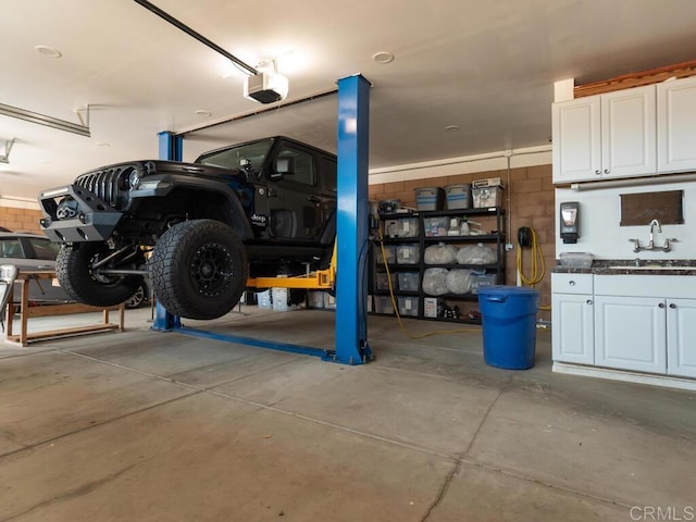 31755 Rancho Vista Rd, Temecula, CA 92592 - garage with a sink and a garage door opener