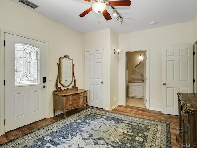 31755 Rancho Vista Rd, Temecula, CA 92592 - foyer with wood finished floors, ceiling fan, and track lighting