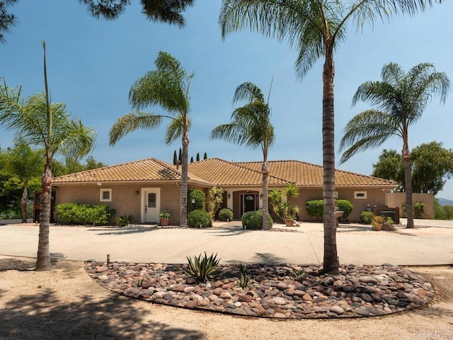 31755 Rancho Vista Rd, Temecula, CA 92592 - view of front facade featuring curved driveway, stucco siding, and a tiled roof