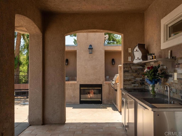 31755 Rancho Vista Rd, Temecula, CA 92592 - view of patio with a glass covered fireplace and a sink