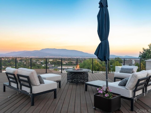 31755 Rancho Vista Rd, Temecula, CA 92592 - deck at dusk featuring a mountain view and an outdoor living space with a fire pit