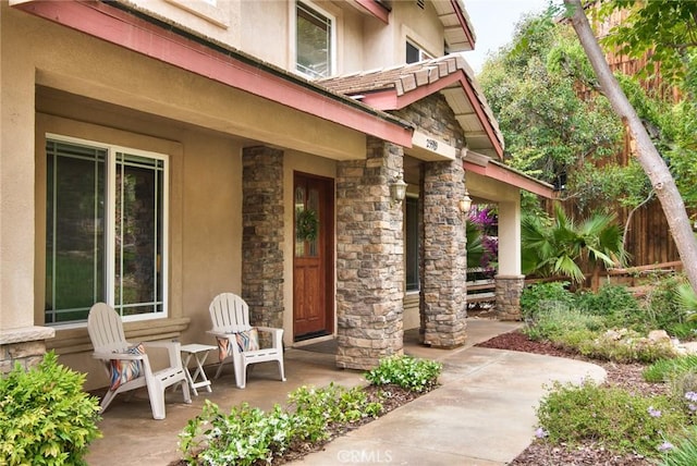 25919 Matlin Rd, Ramona, CA 92065 - property entrance with stone siding, stucco siding, and a porch