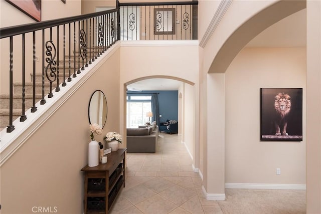 25919 Matlin Rd, Ramona, CA 92065 - corridor with arched walkways, tile patterned flooring, and stairs