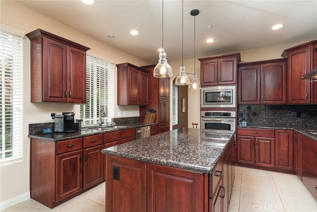 25919 Matlin Rd, Ramona, CA 92065 - kitchen featuring stainless steel appliances, light tile patterned floors, a center island, hanging light fixtures, and recessed lighting