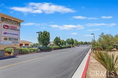 19128 Cedar Dr, Apple Valley, CA 92308 - view of asphalt road featuring street lighting and curbs