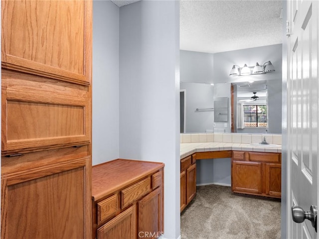 19128 Cedar Dr, Apple Valley, CA 92308 - bathroom with vanity and a textured ceiling