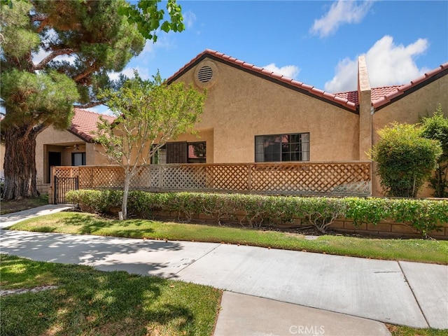 19128 Cedar Dr, Apple Valley, CA 92308 - view of front facade featuring a tile roof and stucco siding