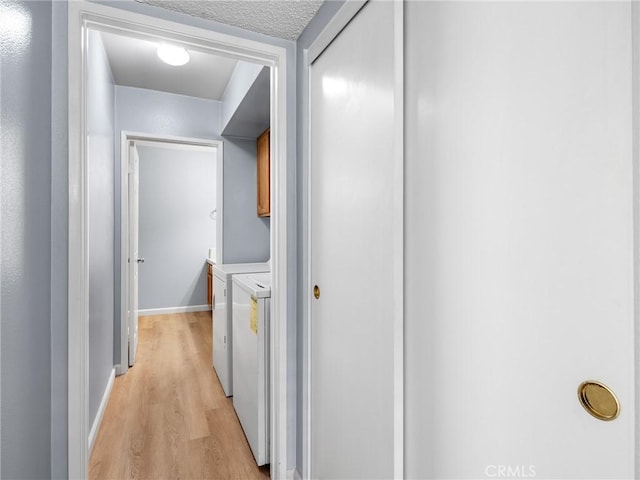 19128 Cedar Dr, Apple Valley, CA 92308 - hallway with washing machine and dryer and light wood-type flooring