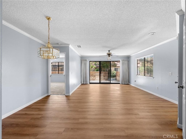19128 Cedar Dr, Apple Valley, CA 92308 - spare room with a chandelier, crown molding, a ceiling fan, light wood-style flooring, and a textured ceiling