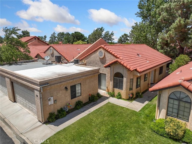 19128 Cedar Dr, Apple Valley, CA 92308 - view of front of home featuring a front yard, a garage, stucco siding, and a tile roof