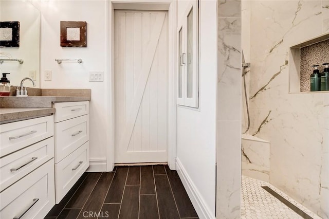 5101 Caspian Cir, Huntington Beach, CA 92649 - full bath with vanity, a marble finish shower, and wood finished floors
