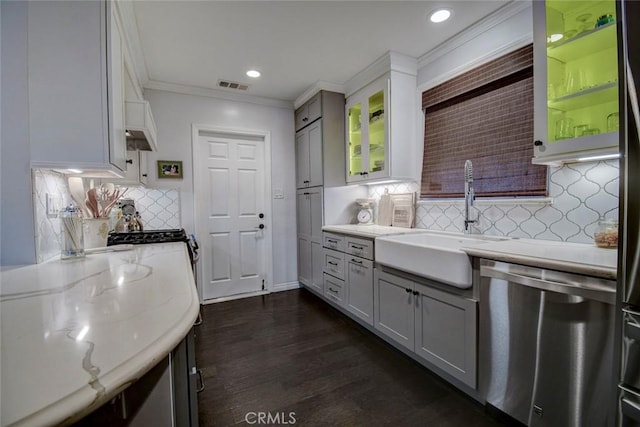 5101 Caspian Cir, Huntington Beach, CA 92649 - kitchen featuring stainless steel dishwasher, decorative backsplash, glass insert cabinets, light stone countertops, and ornamental molding