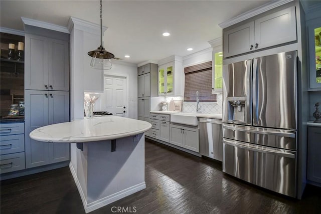 5101 Caspian Cir, Huntington Beach, CA 92649 - kitchen with appliances with stainless steel finishes, crown molding, backsplash, recessed lighting, and dark wood-style floors