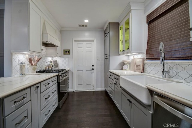 5101 Caspian Cir, Huntington Beach, CA 92649 - kitchen featuring stainless steel appliances, tasteful backsplash, ornamental molding, white cabinets, and recessed lighting