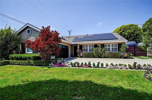 5101 Caspian Cir, Huntington Beach, CA 92649 - ranch-style home with concrete driveway, an attached garage, solar panels, and a front yard