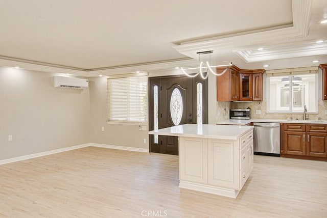 767 Calle Aragon Unit A, Laguna Woods, CA 92637 - kitchen featuring stainless steel appliances, a wall unit AC, crown molding, light wood finished floors, and light countertops