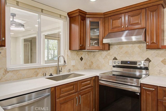 767 Calle Aragon Unit A, Laguna Woods, CA 92637 - kitchen featuring ventilation hood, stainless steel appliances, light countertops, backsplash, and glass insert cabinets