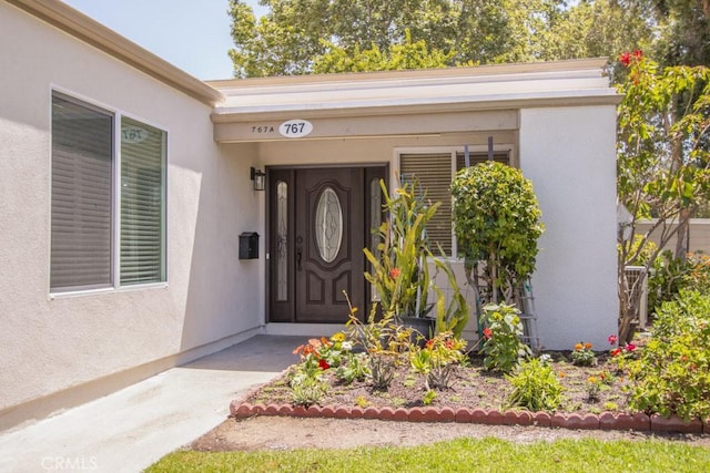 767 Calle Aragon Unit A, Laguna Woods, CA 92637 - property entrance featuring stucco siding
