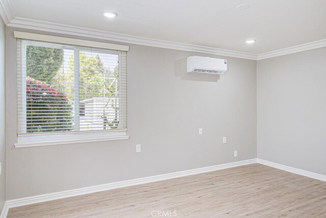 767 Calle Aragon Unit A, Laguna Woods, CA 92637 - spare room featuring ornamental molding, a wall mounted air conditioner, light wood finished floors, and recessed lighting