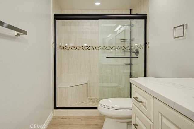 767 Calle Aragon Unit A, Laguna Woods, CA 92637 - bathroom with a stall shower, vanity, and wood finished floors