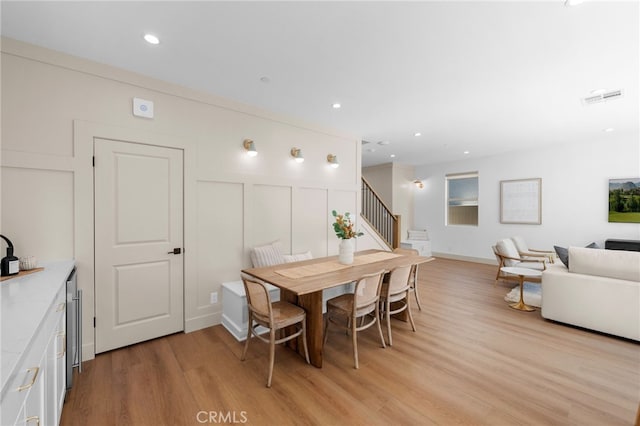 16221 Orizaba Ave, Paramount, CA 90723 - dining area featuring light wood finished floors, stairway, and recessed lighting