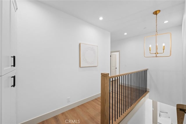 16221 Orizaba Ave, Paramount, CA 90723 - hall with light wood-style floors, an upstairs landing, a chandelier, and recessed lighting