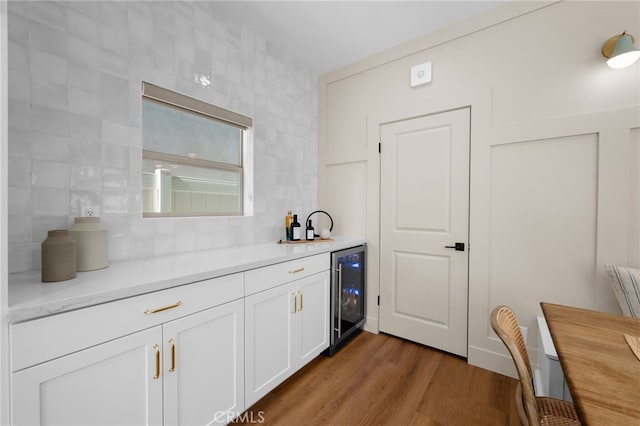 16221 Orizaba Ave, Paramount, CA 90723 - indoor bar featuring wine cooler, decorative backsplash, and dark wood-style flooring