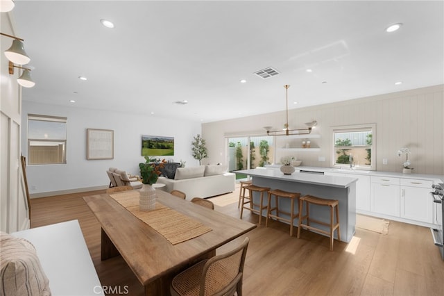 16221 Orizaba Ave, Paramount, CA 90723 - dining area with plenty of natural light, light wood-style floors, and recessed lighting