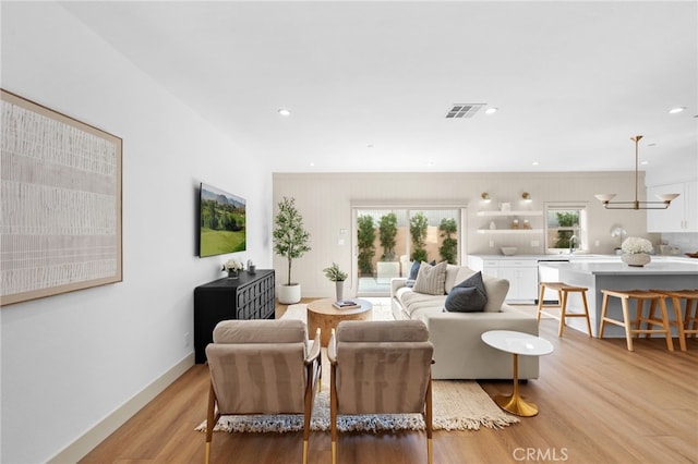 16221 Orizaba Ave, Paramount, CA 90723 - living room with light wood-type flooring and recessed lighting