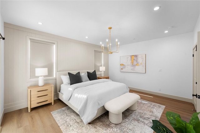 16221 Orizaba Ave, Paramount, CA 90723 - bedroom with light wood-type flooring, a chandelier, and recessed lighting