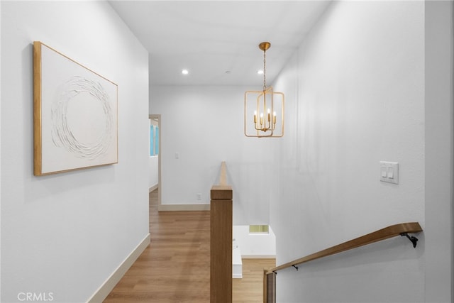 16221 Orizaba Ave, Paramount, CA 90723 - hallway with recessed lighting, light wood-type flooring, and a chandelier