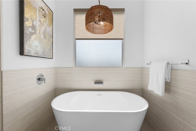 16221 Orizaba Ave, Paramount, CA 90723 - bathroom with a freestanding tub, tile walls, and wainscoting