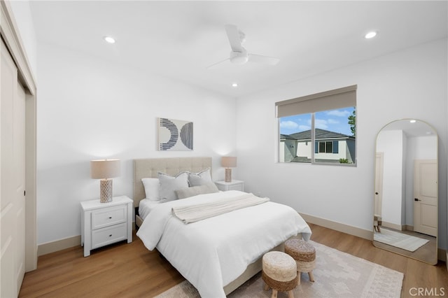 16221 Orizaba Ave, Paramount, CA 90723 - bedroom featuring light wood-style floors, recessed lighting, a closet, arched walkways, and a ceiling fan