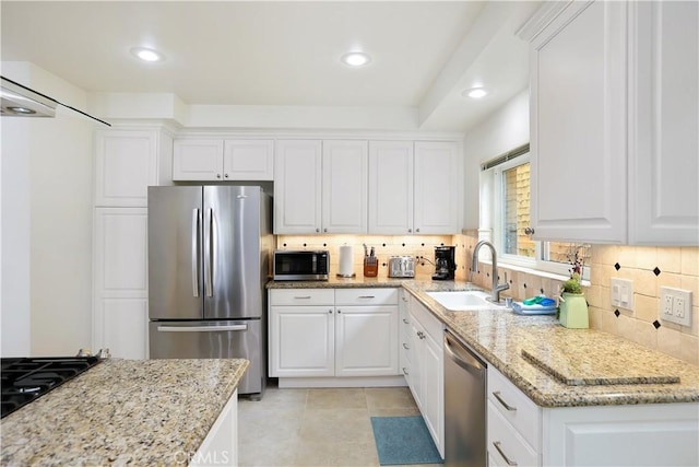 617 Iris Ave, Corona Del Mar, CA 92625 - kitchen featuring stainless steel appliances, backsplash, white cabinetry, and recessed lighting