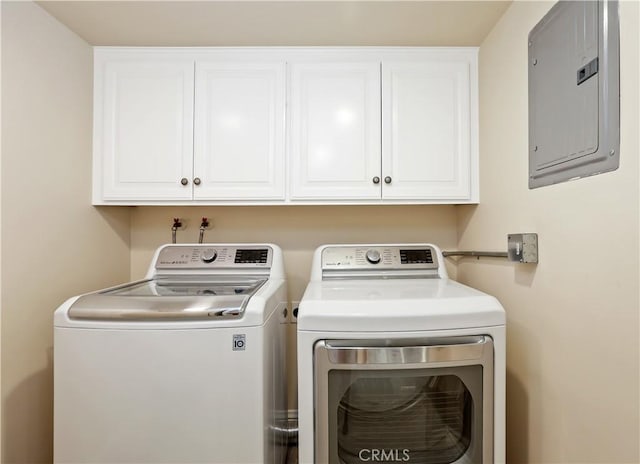617 Iris Ave, Corona Del Mar, CA 92625 - laundry area with electric panel, washing machine and clothes dryer, and cabinet space