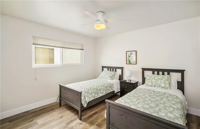 617 Iris Ave, Corona Del Mar, CA 92625 - bedroom with wood finished floors and a ceiling fan