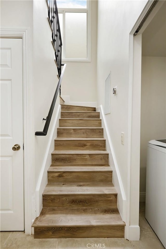 617 Iris Ave, Corona Del Mar, CA 92625 - stairway featuring washer / clothes dryer