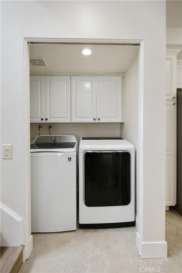 617 Iris Ave, Corona Del Mar, CA 92625 - washroom featuring cabinet space, independent washer and dryer, light tile patterned floors, and recessed lighting