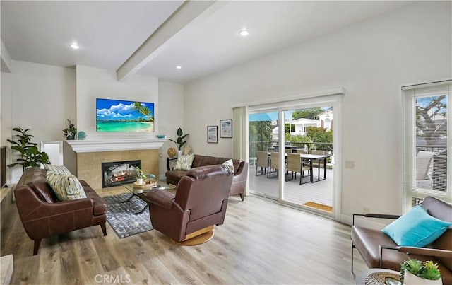 617 Iris Ave, Corona Del Mar, CA 92625 - living room featuring wood finished floors, plenty of natural light, a glass covered fireplace, beam ceiling, and recessed lighting
