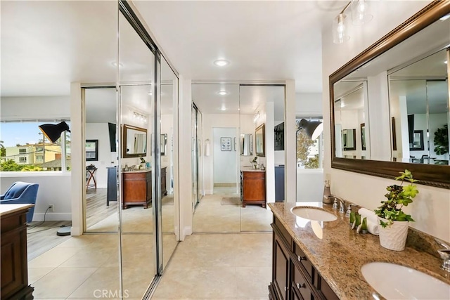 617 Iris Ave, Corona Del Mar, CA 92625 - bathroom featuring healthy amount of natural light, double vanity, and recessed lighting
