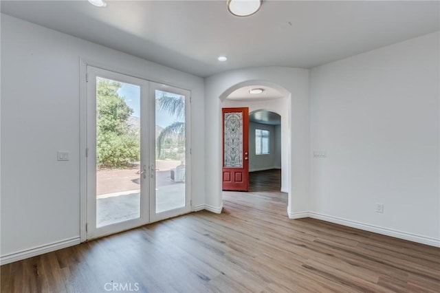 35050 Margo Rd, Lake Elsinore, CA 92530 - foyer entrance with french doors, arched walkways, wood finished floors, and recessed lighting