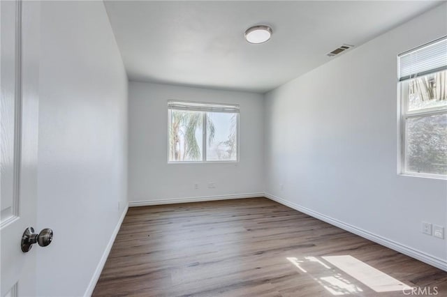 35050 Margo Rd, Lake Elsinore, CA 92530 - unfurnished room with wood finished floors and baseboards