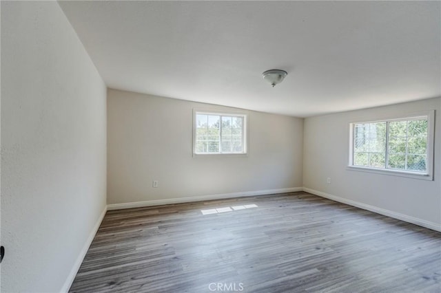 35050 Margo Rd, Lake Elsinore, CA 92530 - spare room with healthy amount of natural light and wood finished floors