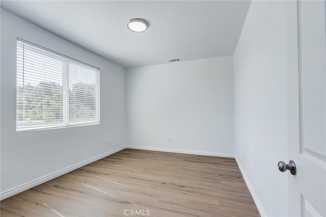 35050 Margo Rd, Lake Elsinore, CA 92530 - unfurnished room with light wood-style floors and baseboards