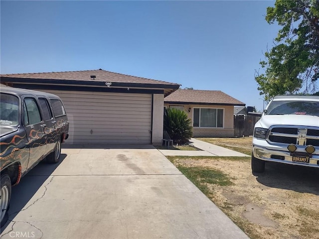 5309 Sage Dr, Bakersfield, CA 93309 - ranch-style house with driveway, an attached garage, and brick siding