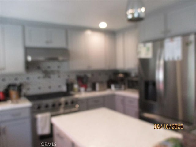 9244 Whitting Way, Riverside, CA 92508 - kitchen with stainless steel stove, light countertops, and backsplash