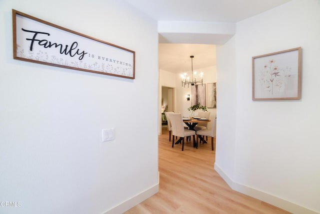 307 E Walnut Ave Unit D, Monrovia, CA 91016 - hall featuring a chandelier and light wood-style flooring