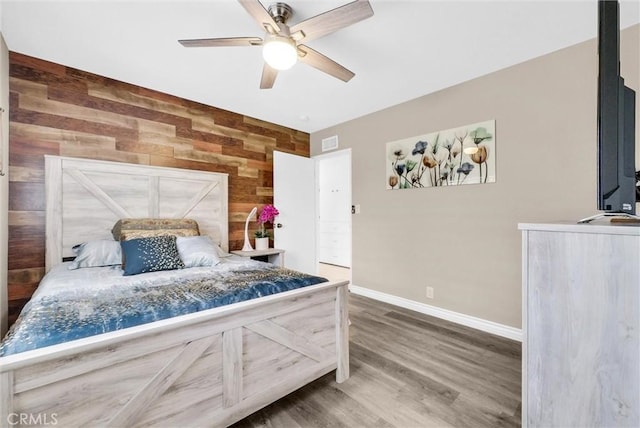 1115 E Sierra Madre Ave, Glendora, CA 91741 - bedroom with wooden walls, wood finished floors, and a ceiling fan